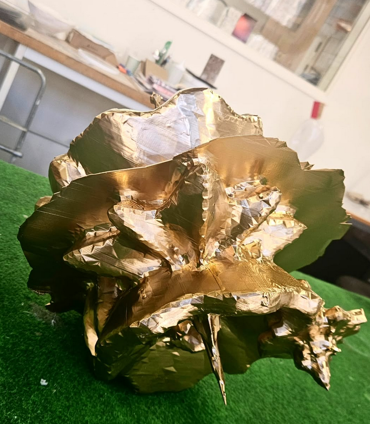 Gold-painted organism